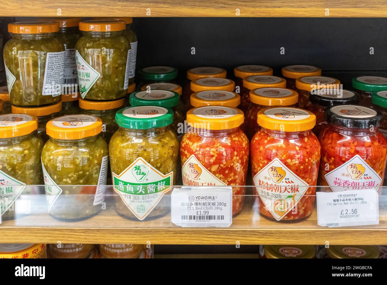 Asian Chinese Oriental food, red and green chilli in jars, in Yohome Oriental Lifestyle on supermarket shelves, London, England, UK Stock Photo