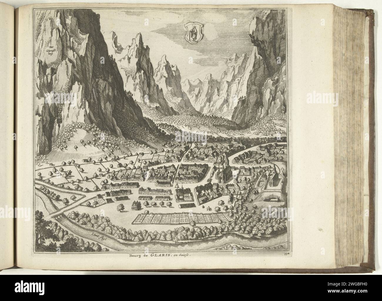 View of Glarus, 1726, 1726 print View on the town of Glarus located in a valley between the mountains in Switzerland. Plate no. 330 in Part XIV of the print work: Les Forces de l'Europe, Asie, Afrique et Amerique ... Comme Aussi Les Cartes des Côtes de France et d'Espagne from 1726, this second part with 271 by hand numbered Plates of renowned strong cities and fortresses in the context of the Spanish War of Succession 1701-1713. For the most part, these records have been copied to the anonymous French records of renowned strong cities and forces: in Les Forces de l'Europe and in: Le Theater d Stock Photo