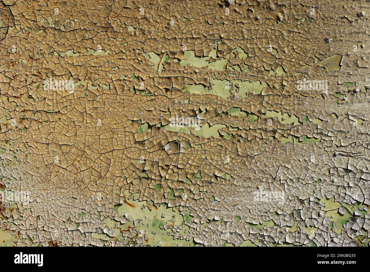Detail of the flaking paint from the used metal surface Stock Photo