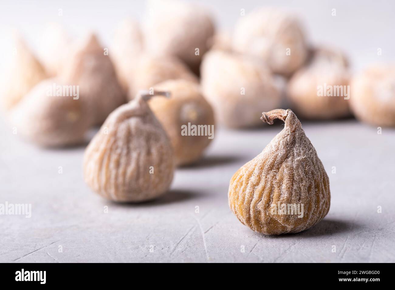 dried figs floured with rice flour. Selective focus on the foreground. Stock Photo