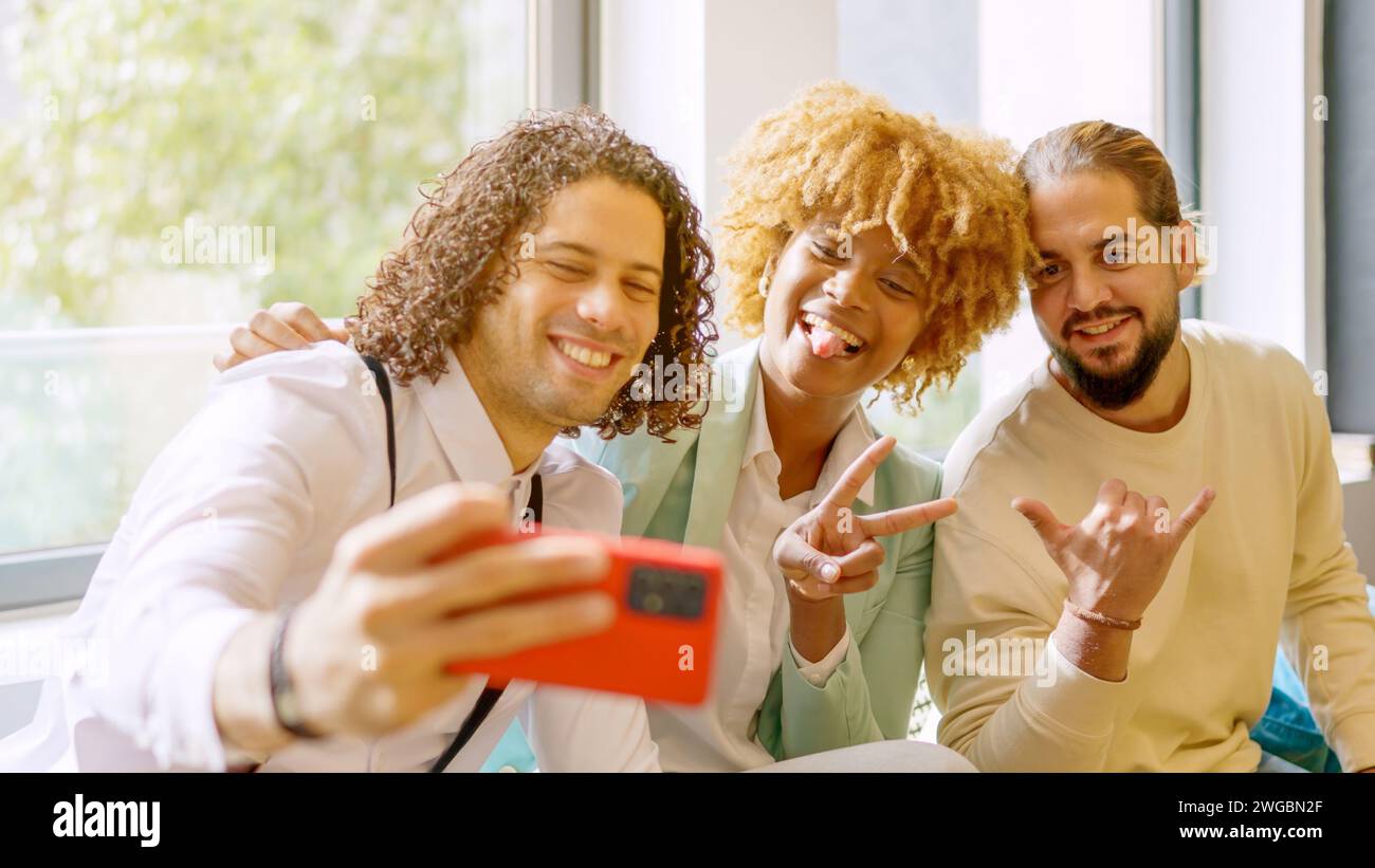 Coworkers taking a selfie during a work break Stock Photo