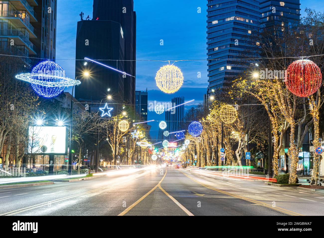 Downtown cityscape at night with solar system inspired lighting decorations, Vake, Tbilisi, Georgia Stock Photo