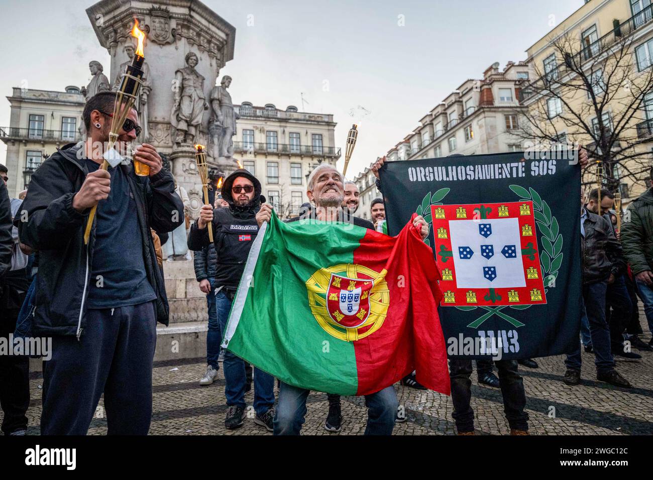 Lisbon, Portugal. 03rd Feb, 2024. Activists hold flags while shouting