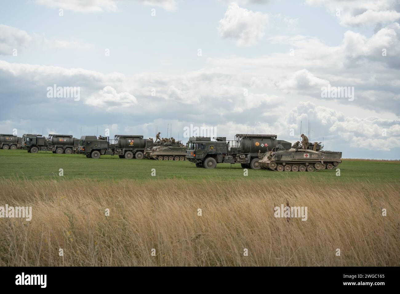 British army M.A.N. HX58 unit support tankers refuelling Warrior FV510 IFV tanks Stock Photo