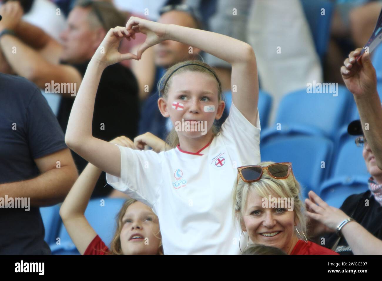 Girl fans make love heart emoji symbol with their hands England v Spain, UEFA Womens Euro 2022, at Brighton Community Stadium 20 July 2022 Stock Photo
