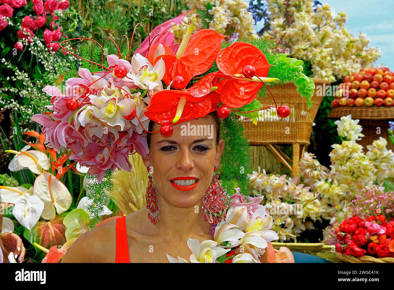 Portrait woman, flowers, splendour of blossoms, orchids, anthuriums, flower festival, Funchal, Madeira Island Stock Photo