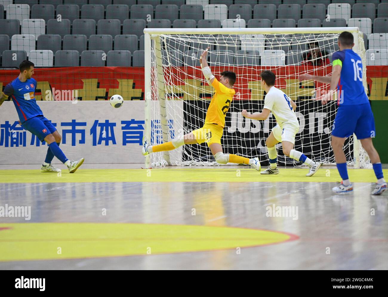 Xi'an, China's Shaanxi Province. 4th Feb, 2024. Finland's goalkeeper Kasper Kangas (2nd L) defends Slovakia's Zatovic Patrik (1st L) during a match between Finland and Slovakia at the CFA 'Yulin Tourism Investment' Cup Futsal International Tournament 2024 in Xi'an, northwest China's Shaanxi Province, Feb. 4, 2024. Credit: Li Yibo/Xinhua/Alamy Live News Stock Photo