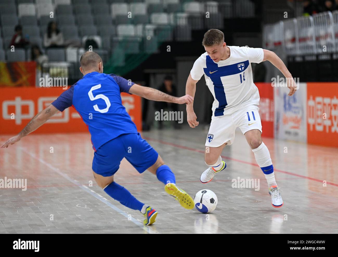 Xi'an, China's Shaanxi Province. 4th Feb, 2024. Finland's Lassi Lintula (R) vies with Slovakia's Vaktor Filip during a match between Finland and Slovakia at the CFA 'Yulin Tourism Investment' Cup Futsal International Tournament 2024 in Xi'an, northwest China's Shaanxi Province, Feb. 4, 2024. Credit: Li Yibo/Xinhua/Alamy Live News Stock Photo