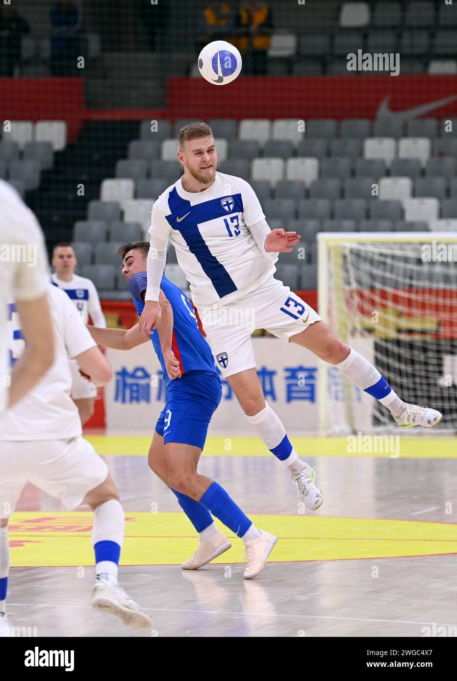 Xi'an, China's Shaanxi Province. 4th Feb, 2024. Finland's Jani Korpela (R) vies for the ball during a match between Finland and Slovakia at the CFA 'Yulin Tourism Investment' Cup Futsal International Tournament 2024 in Xi'an, northwest China's Shaanxi Province, Feb. 4, 2024. Credit: Li Yibo/Xinhua/Alamy Live News Stock Photo