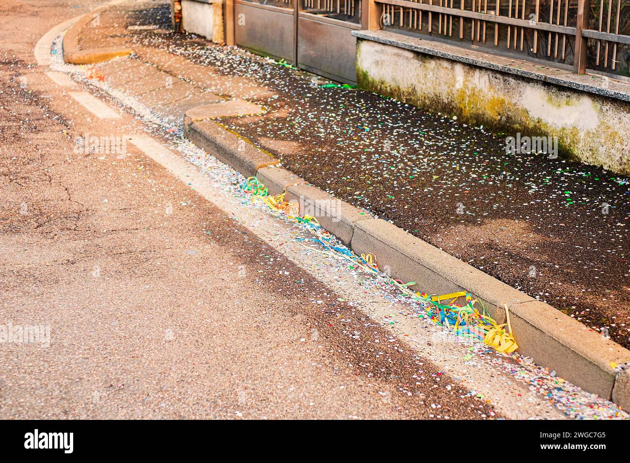 Colorful confetti and streamers at the street after Carnival show Stock ...