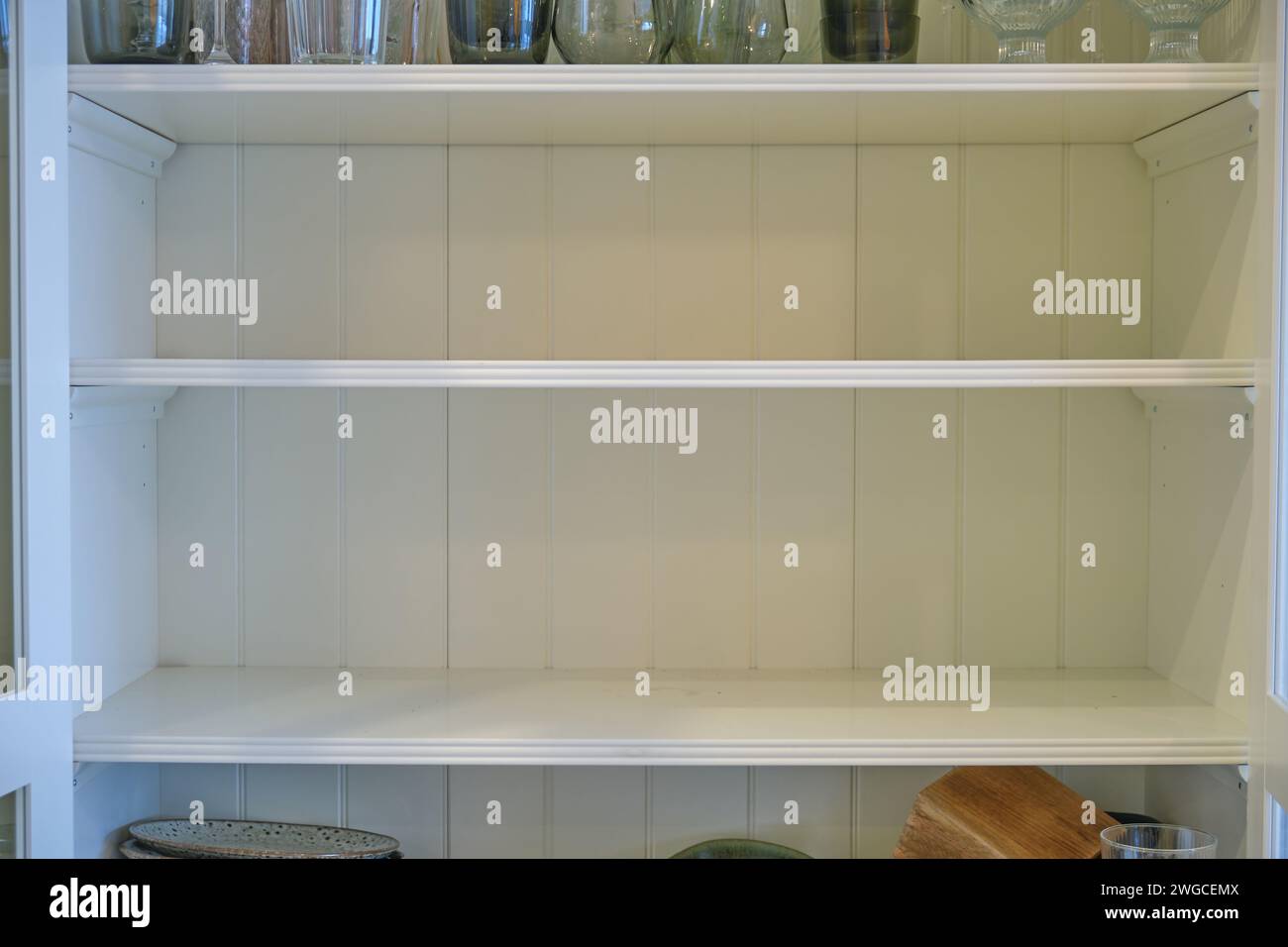 Empty shelves of the kitchen cabinet without dishes and plates Stock ...