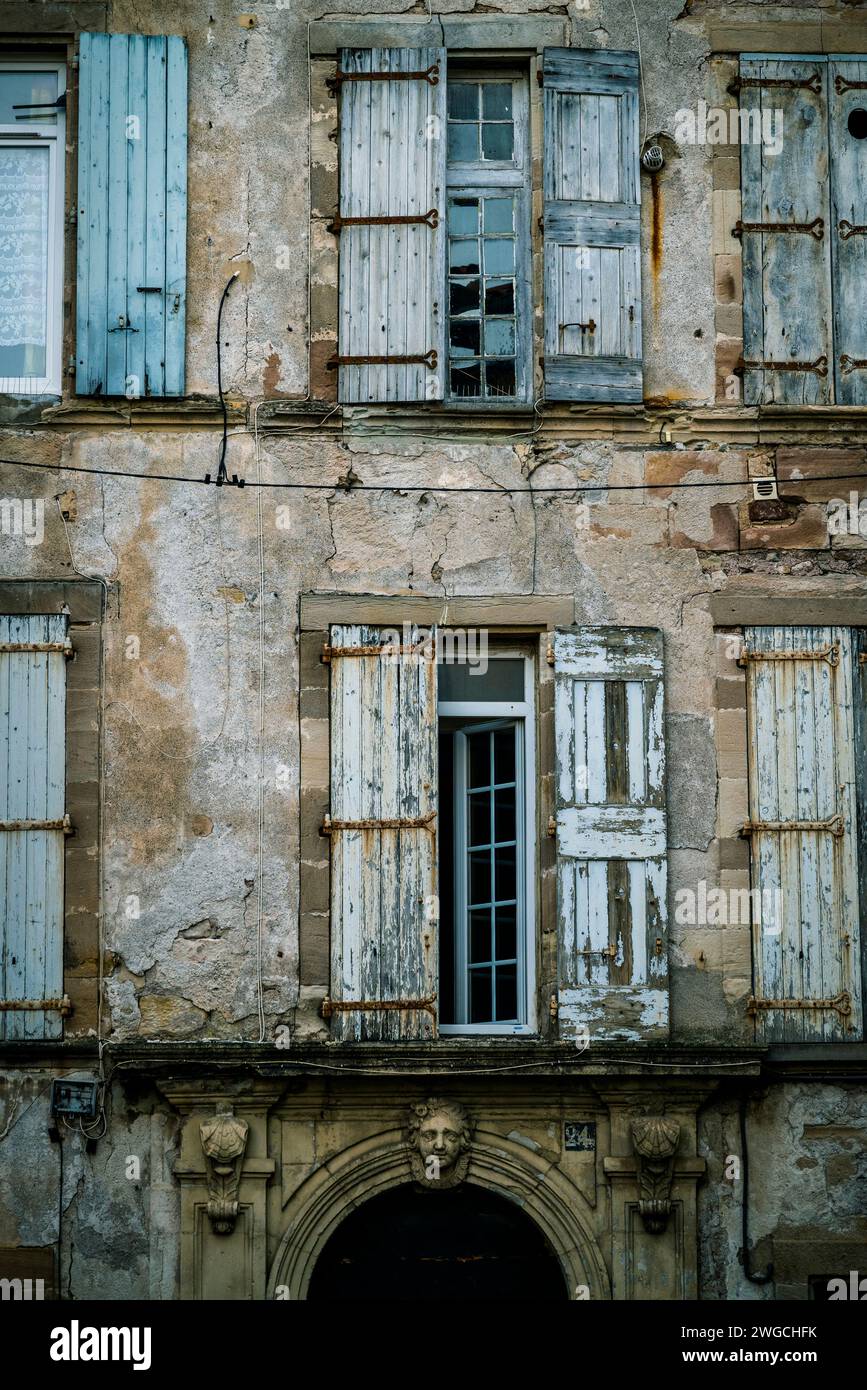 Windows and decaying facade, , Lodève, a town in département of Hérault, Occitanie region, southern France Stock Photo