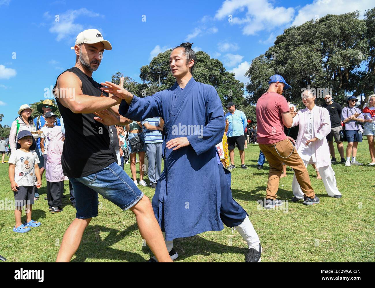 Auckland, New Zealand. 4th Feb, 2024. People learn Chinese Wudang Kongfu during the 'Happy Chinese New Year' Beach Carnival in Auckland, New Zealand, Feb. 4, 2024. The 'Happy Chinese New Year' Beach Carnival, co-hosted by the China Cultural Centre in Auckland and the Asian Community Engagement Trust, was held at the Mission Bay Beach in Auckland on Sunday. Credit: Guo Lei/Xinhua/Alamy Live News Stock Photo