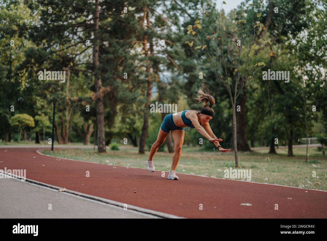 Fit, flexible female performing 360-degree cartwheels and flips in an ...