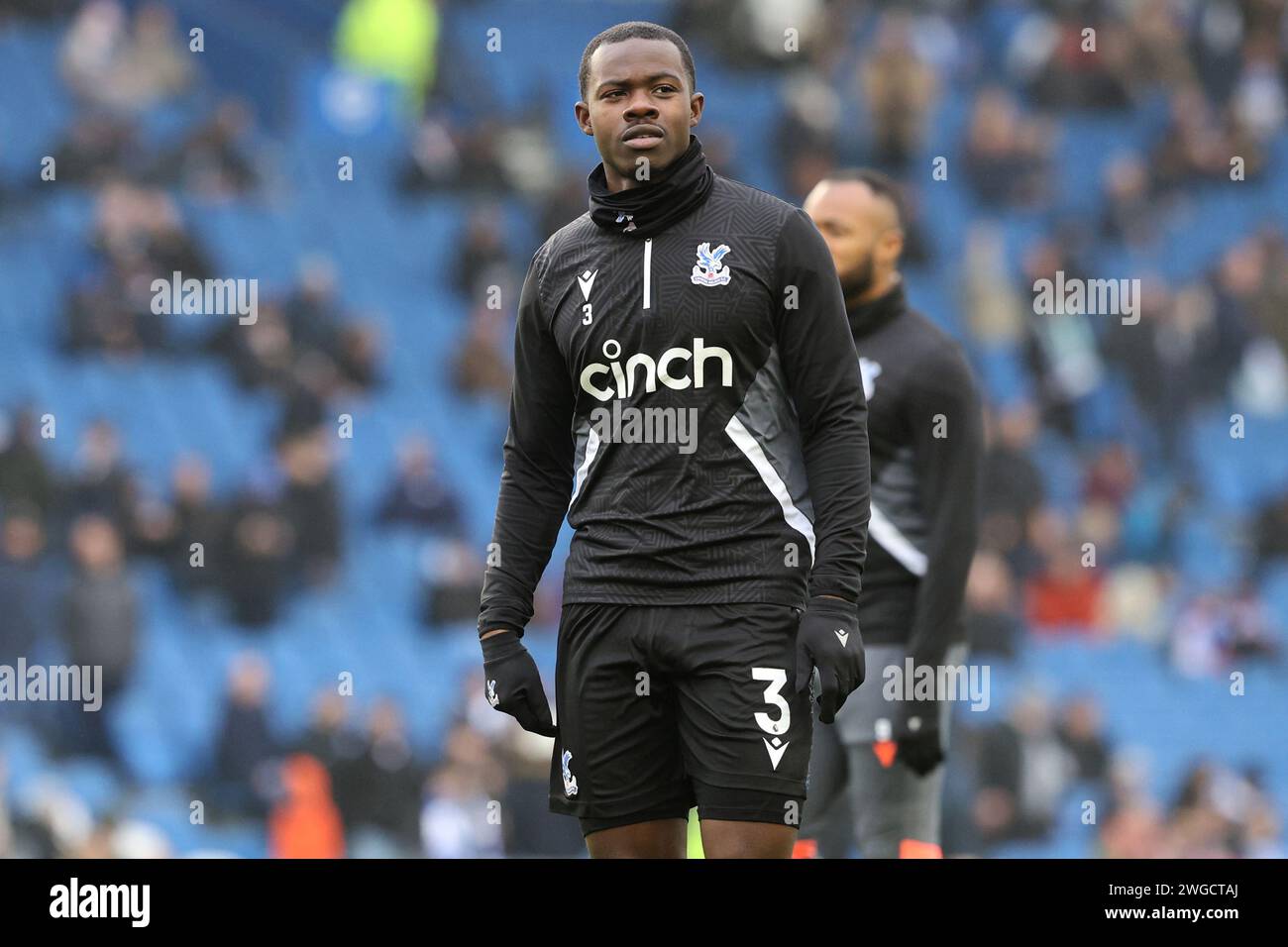 Tyrick Mitchell warms up before kick off for Crystal Palace FC at the AMEX stadium in Brighton Stock Photo