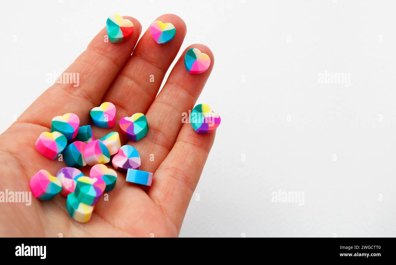 Hand holding colorful beads for making necklaces and bracelets Stock