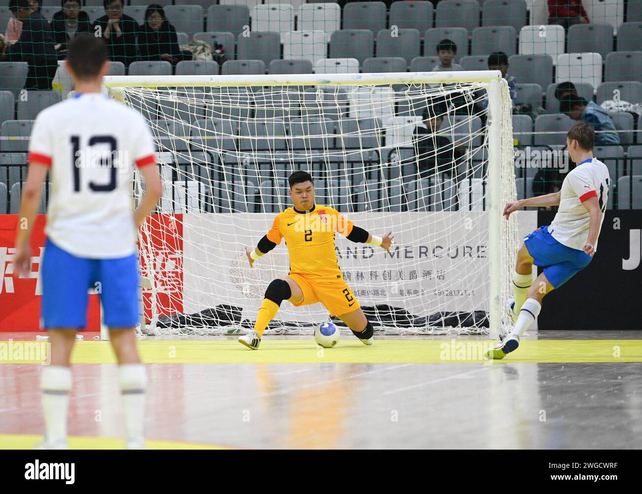 Yulin, China's Shaanxi Province. 4th Feb, 2024. David Drozd (R) of the Czech Republic shoots to score during a match between China and the Czech Republic at the CFA 'Yulin Tourism Investment' Cup Futsal International Tournament 2024 in Yulin, northwest China's Shaanxi Province, Feb. 4, 2024. Credit: Li Yibo/Xinhua/Alamy Live News Stock Photo