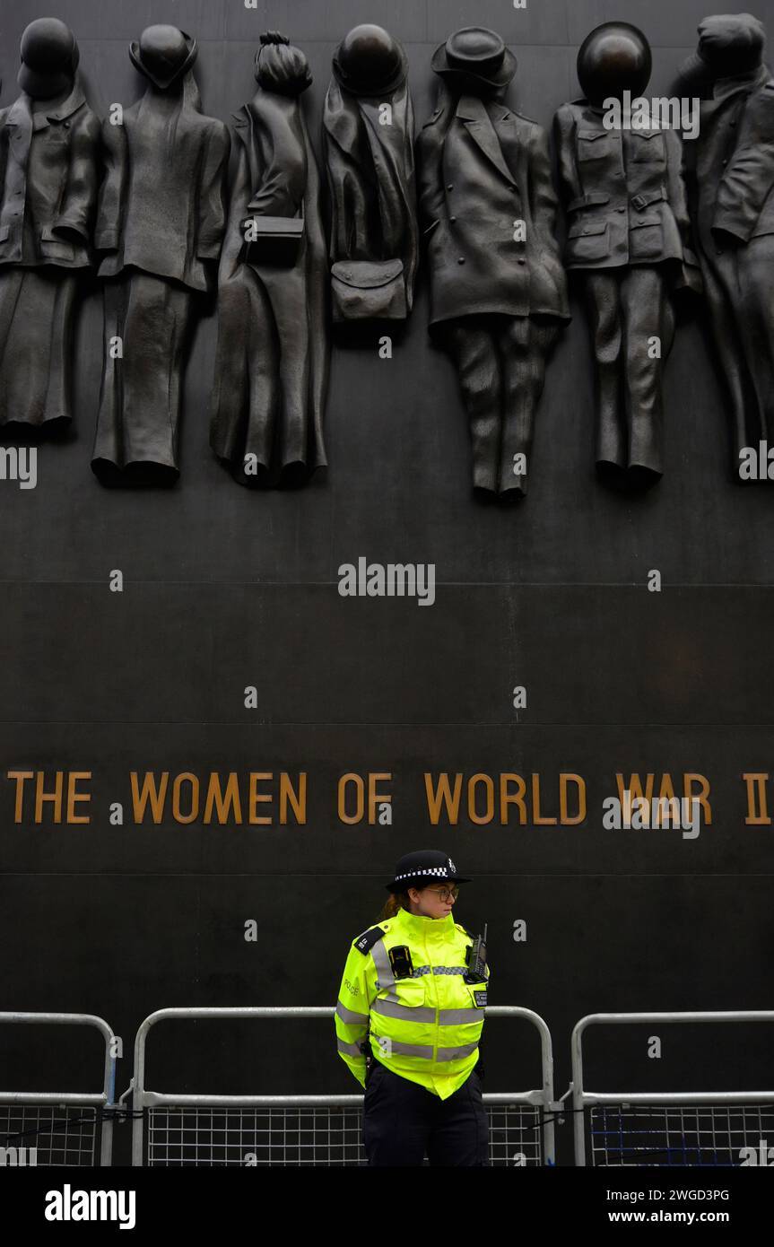 A lone WPC stands guard by The Cenotaph in Whitehall during a Pro-Palestinian protest march in Central London. Saturday, 3rd february 2024. Stock Photo