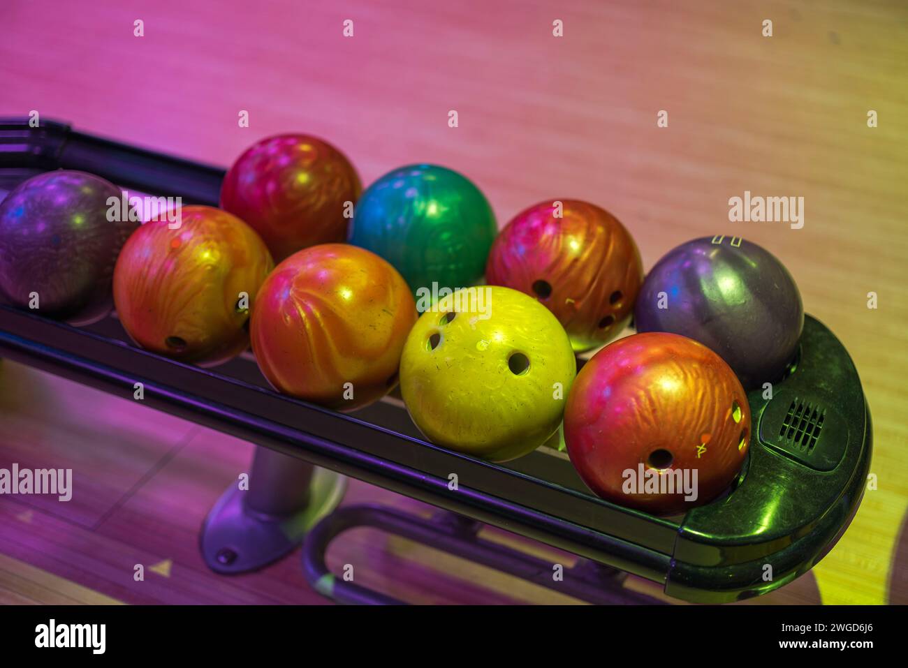 View of automated ball rack system in bowling center, facilitating