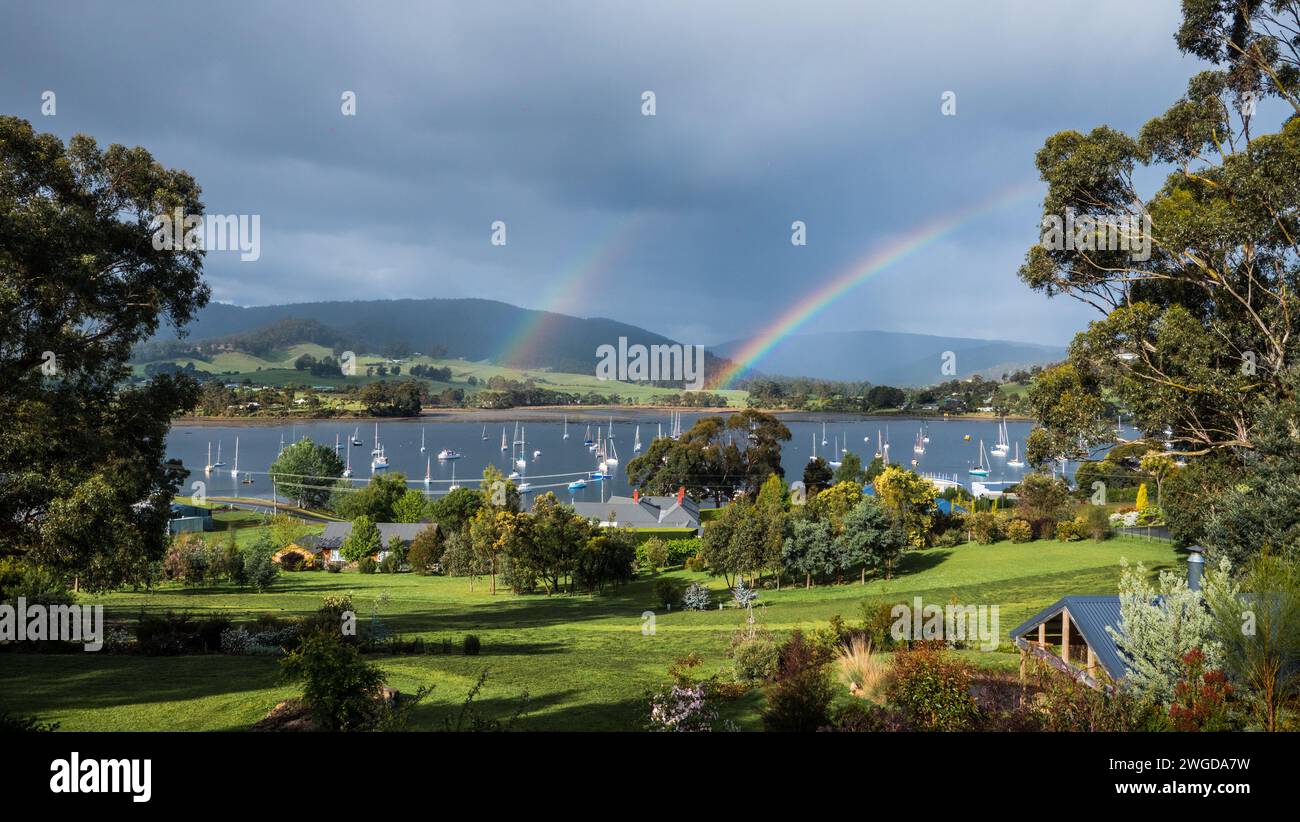 Double rainbow overe Cygnet marina, Tasmania Stock Photo