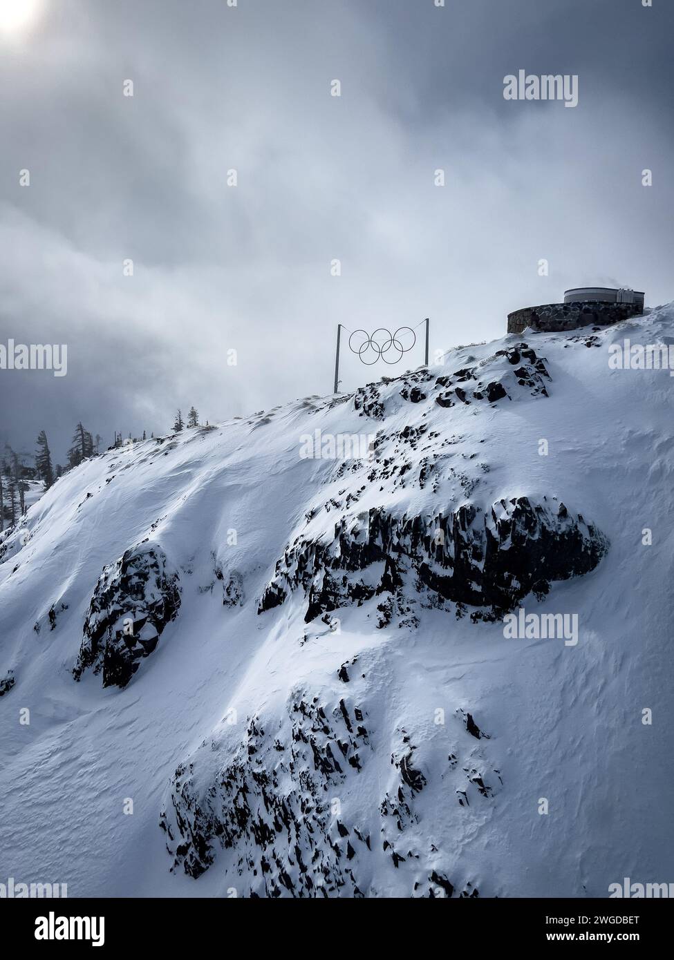 A mountain where they held the olympics covered in snow near Lake Tahoe California with Olympic rings Stock Photo