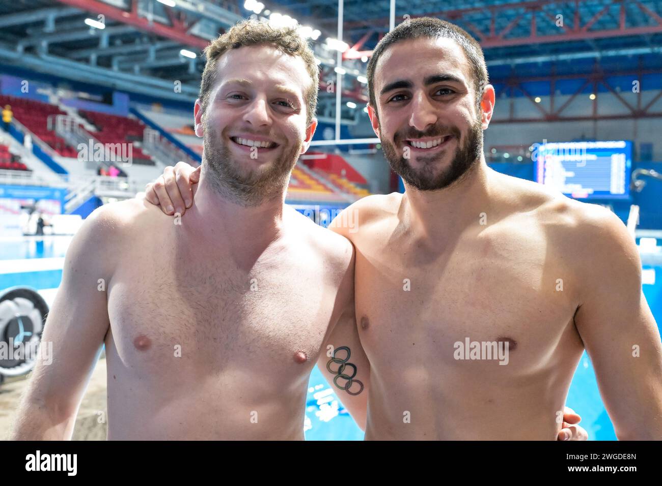 Lorenzo Marsaglia and Giovanni Tocci of Italy react after winning the