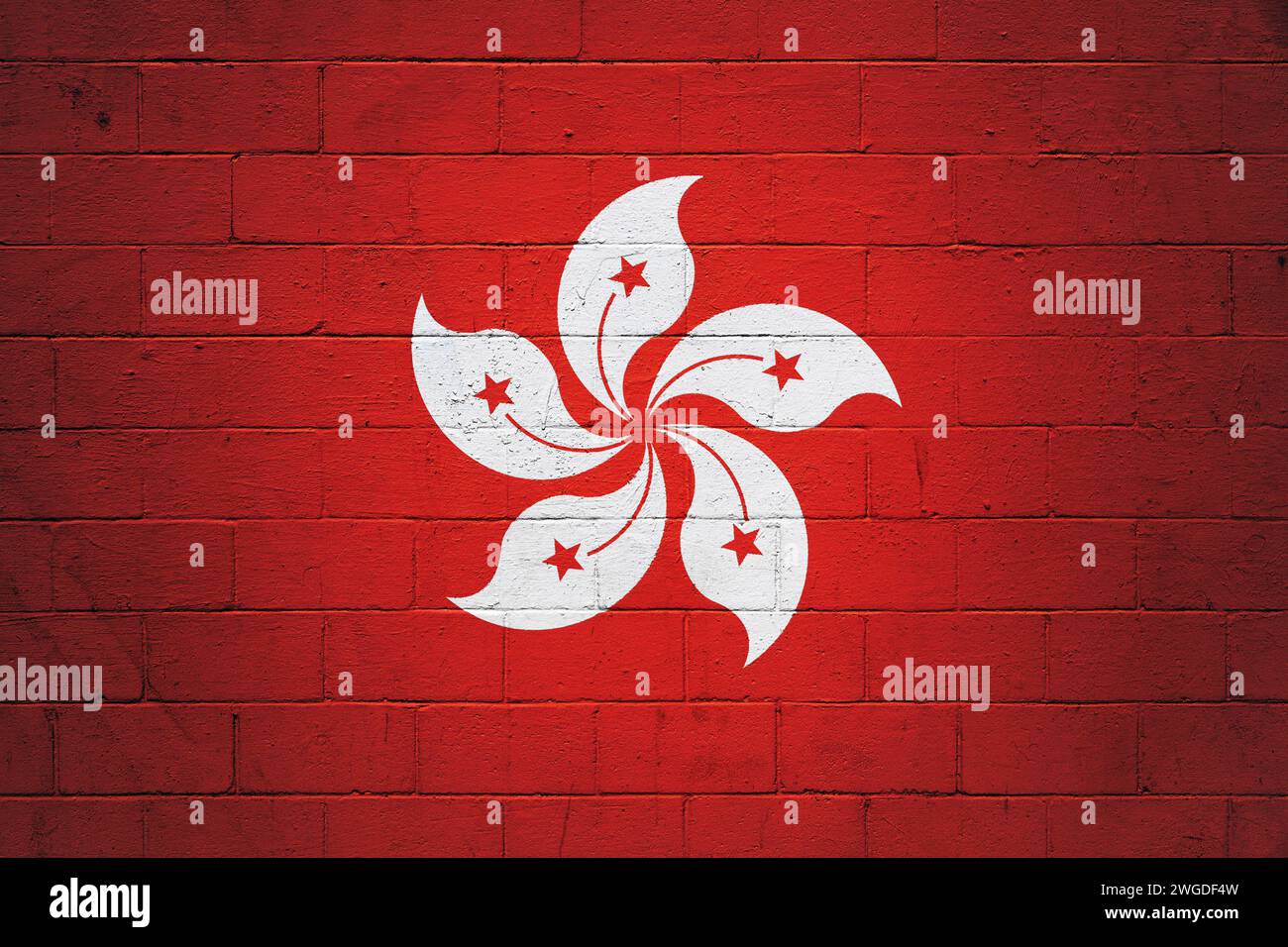 Flag of Hong Kong painted on a cinder block wall. Stock Photo