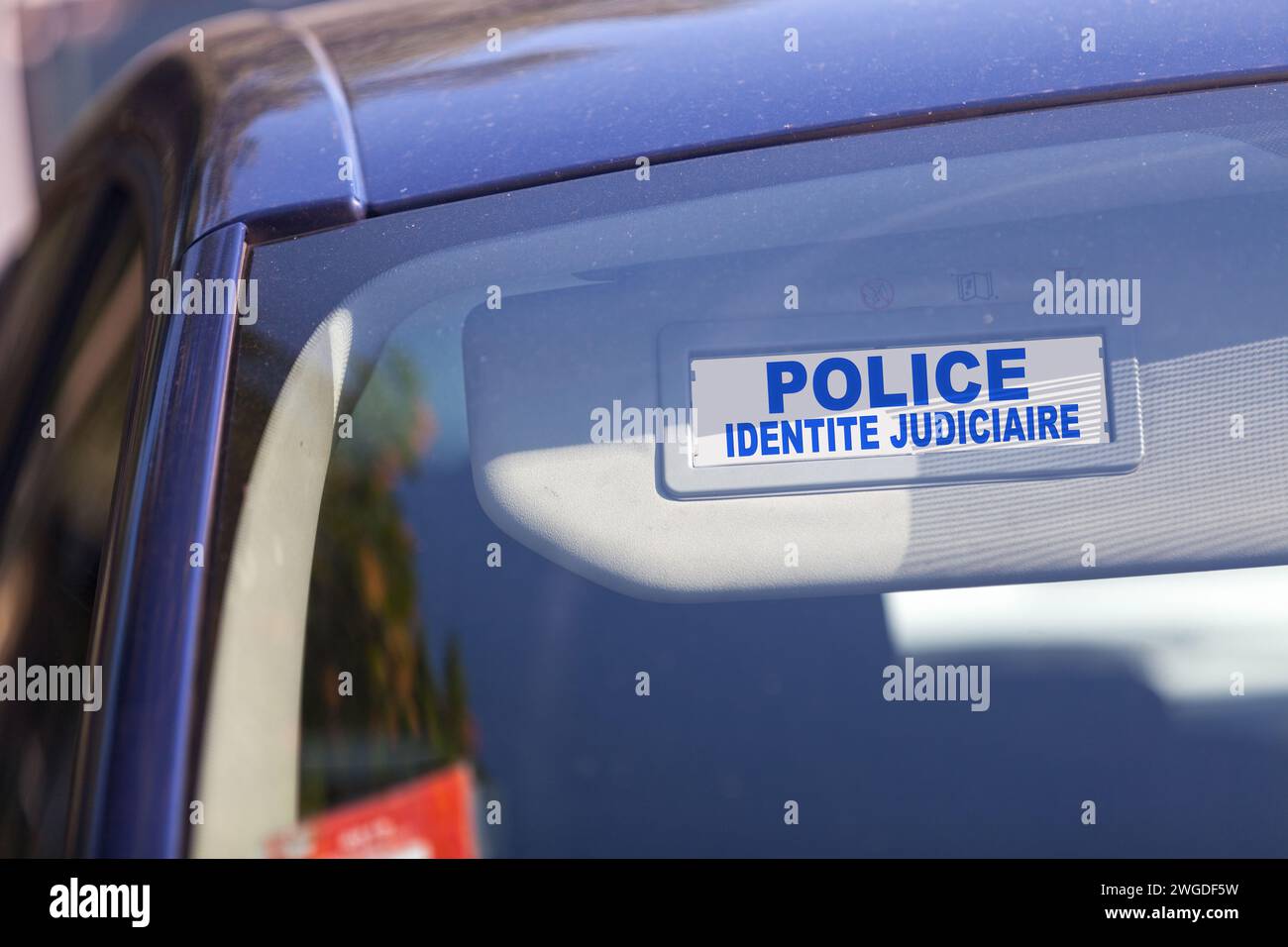 Blue sun visor with written in French 'Police Identité Judiciaire' in it (Scientific police). Stock Photo