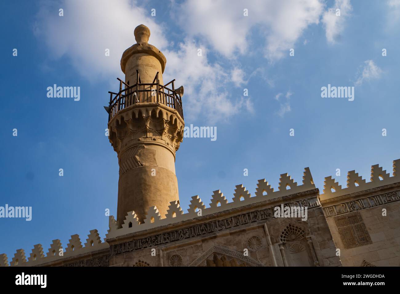 ancient minaret at al-Aqmar Mosque on Moez Street in Fatamid or Medieval Cairo, Egypt Stock Photo