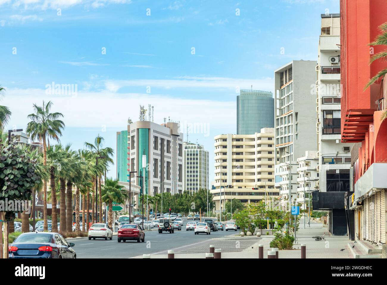 Jeddah downtown central district street with road full of car traffic and modern buildings in the background, Saudi Arabia Stock Photo