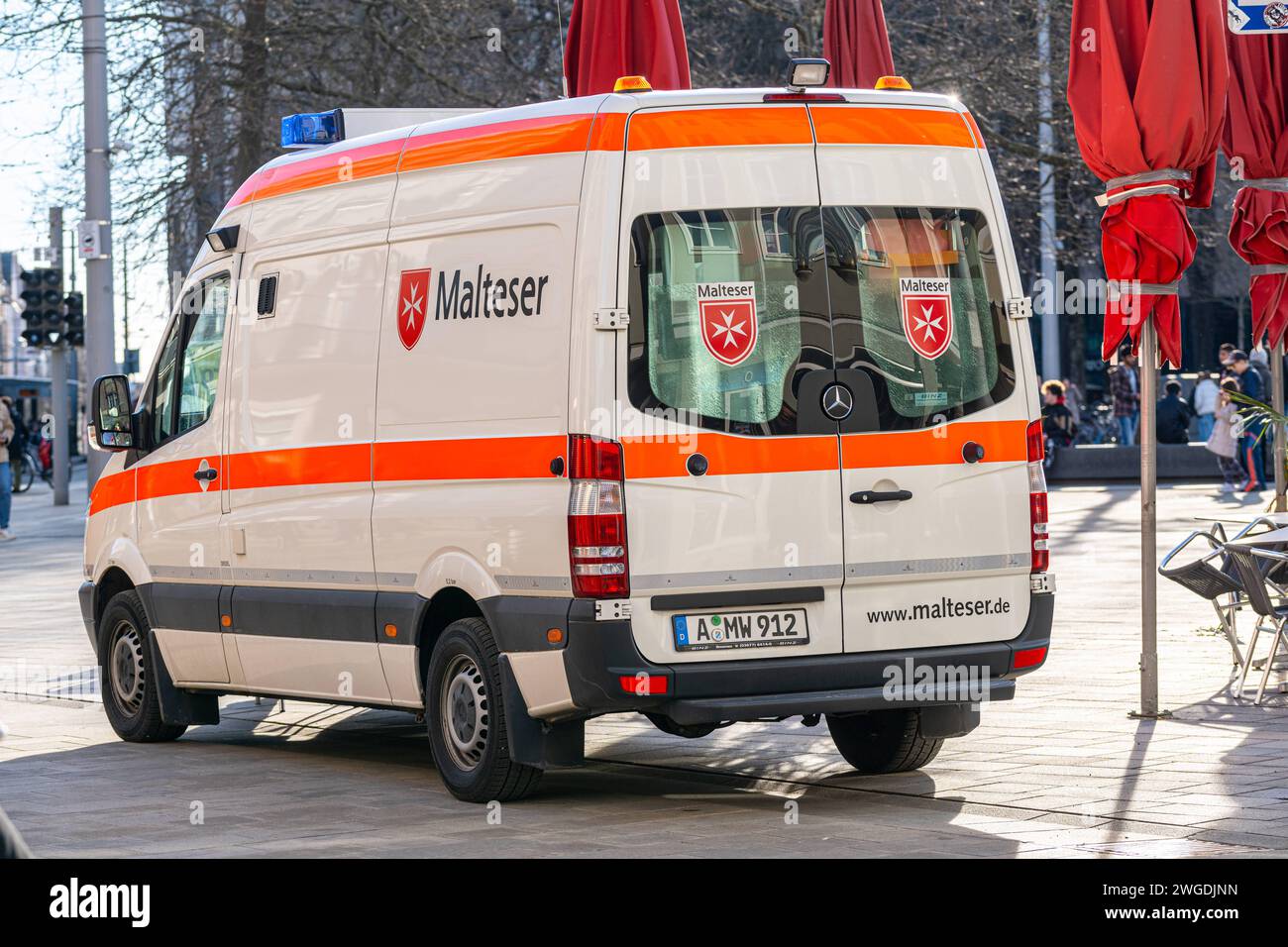 Augsburg, Bavaria, Germany - February 3, 2024: Malteser ambulance in the city center of Augsburg *** Rettungswagen von Malteser in der Innenstadt von Augsburg Stock Photo