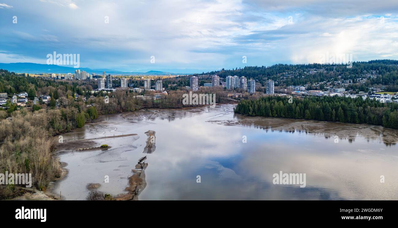 City buildings and homes in suburban city. Aerial View. Port Moody, Vancouver, BC, Canada. Stock Photo