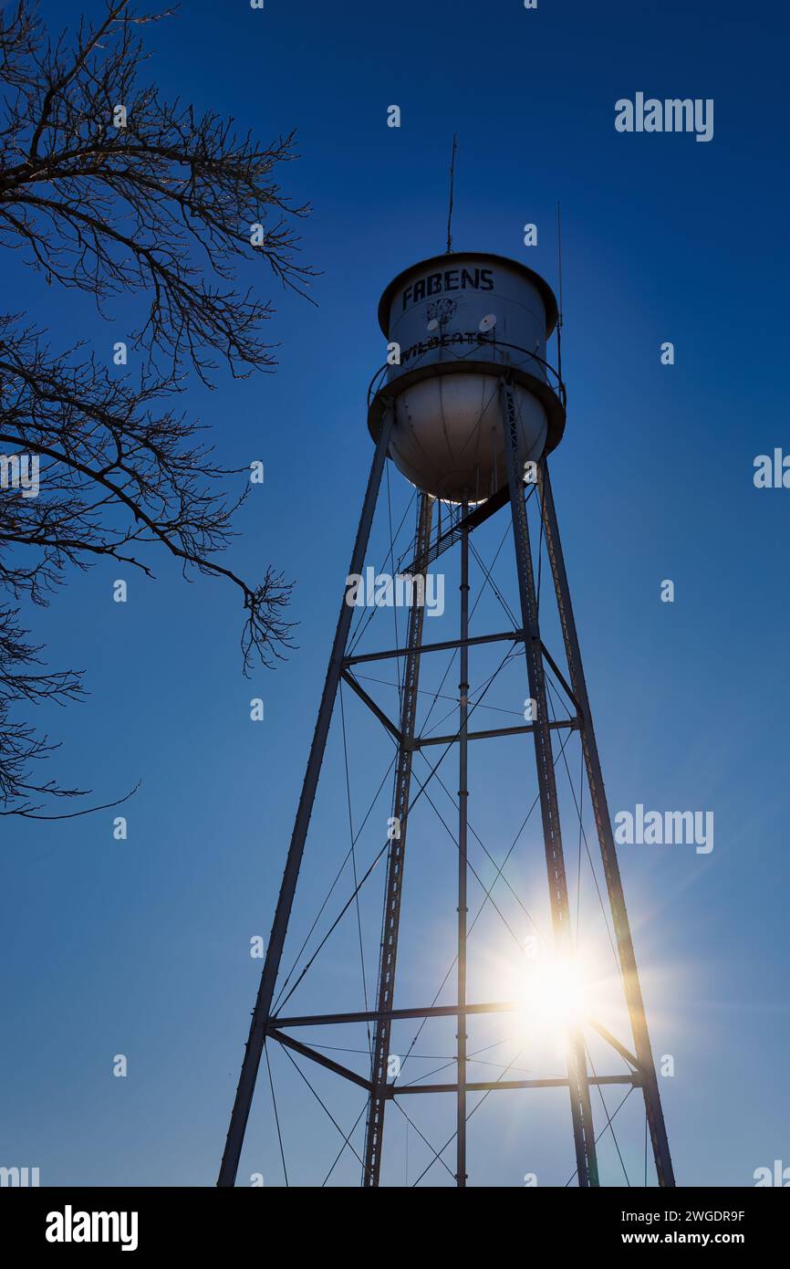 The sun rises behind the water tower in Fabens, Texas Stock Photo Alamy
