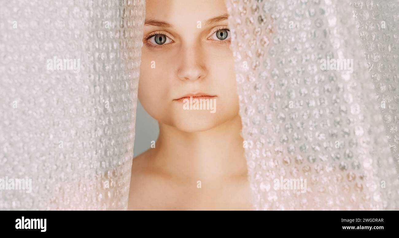Plastic contamination upset woman face bubble wrap Stock Photo Alamy