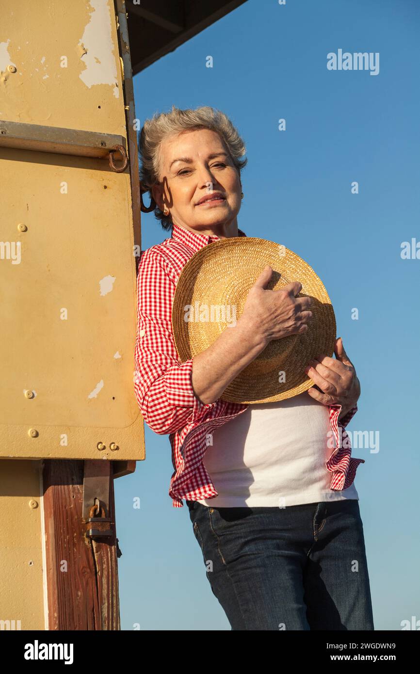 Woman with a hat on the beach, Dania Beach, Florida, USA Stock Photo