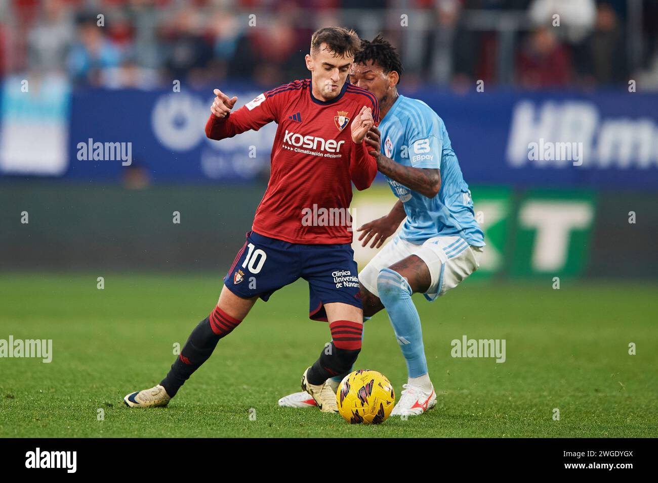 Pamplona, Spain. 04th Feb, 2024. Aimar Oroz of CA Osasuna duels for the ball with Jonathan Bamba of RC Celta during the LaLiga EA Sports match between CA Osasuna and RC Celta at El Sadar Stadium on February 04, 2024 in Pamplona, Spain. Credit: Cesar Ortiz Gonzalez/Alamy Live News Credit: Cesar Ortiz Gonzalez/Alamy Live News Stock Photo