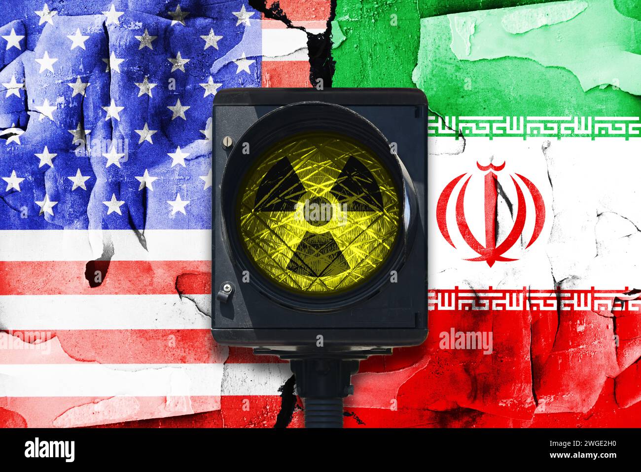 Flags Of The United States And Iran With Crack And Warning Light With Radioactivity Signs, Photomontage Stock Photo