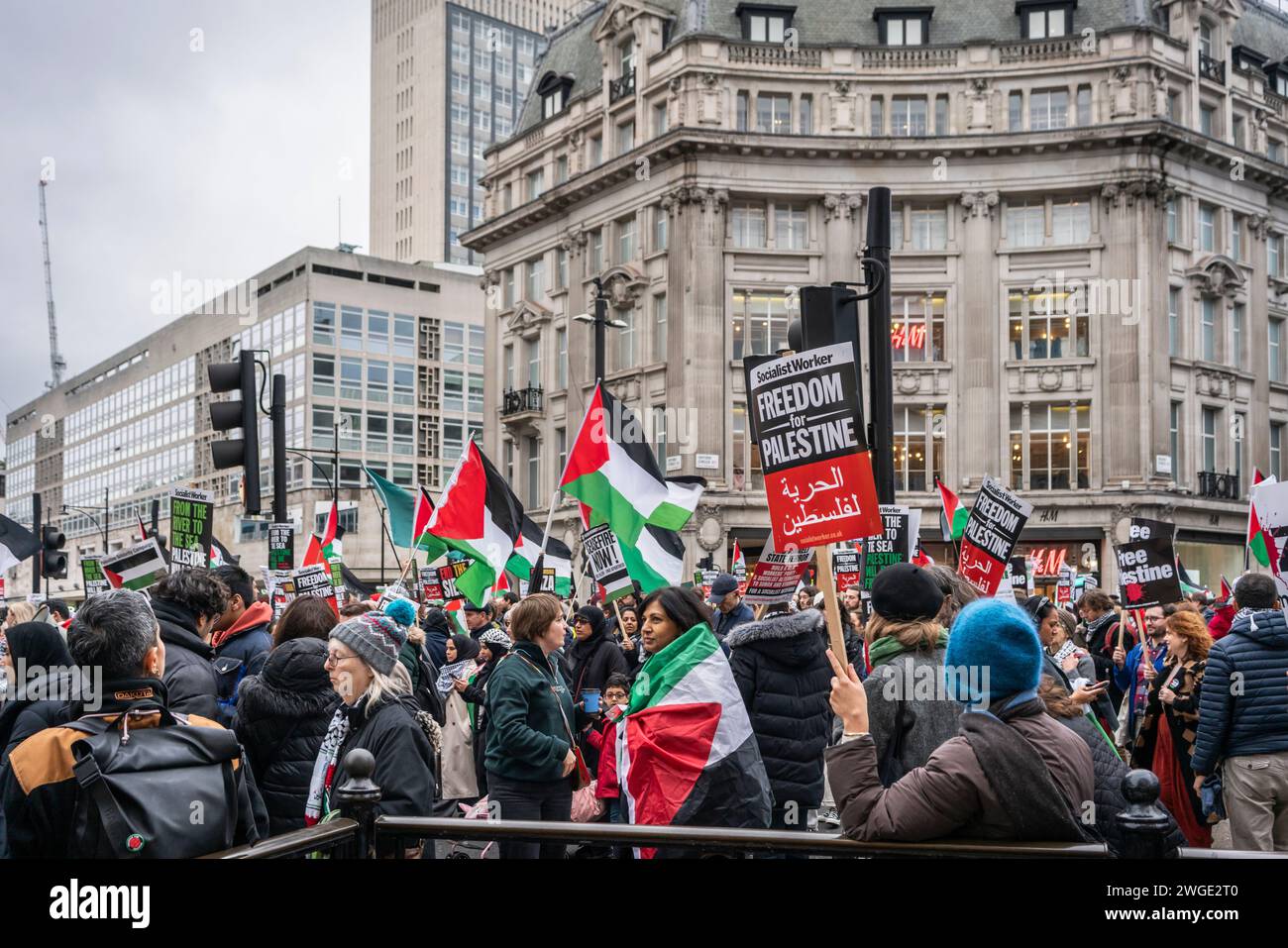 London, UK. 3rd February 2024. Freedom for Palestine banners and Palestinian flags held by peace activists and protesters during the Pro - Palestine march through Oxford Street in Soho, , Free Palestine Movement, London, UK Stock Photo