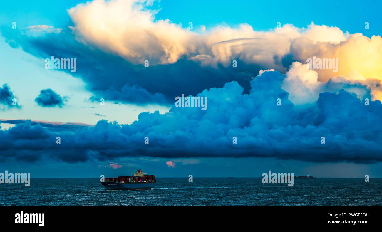 Container ship in the North Sea with storm clouds above Stock Photo - Alamy