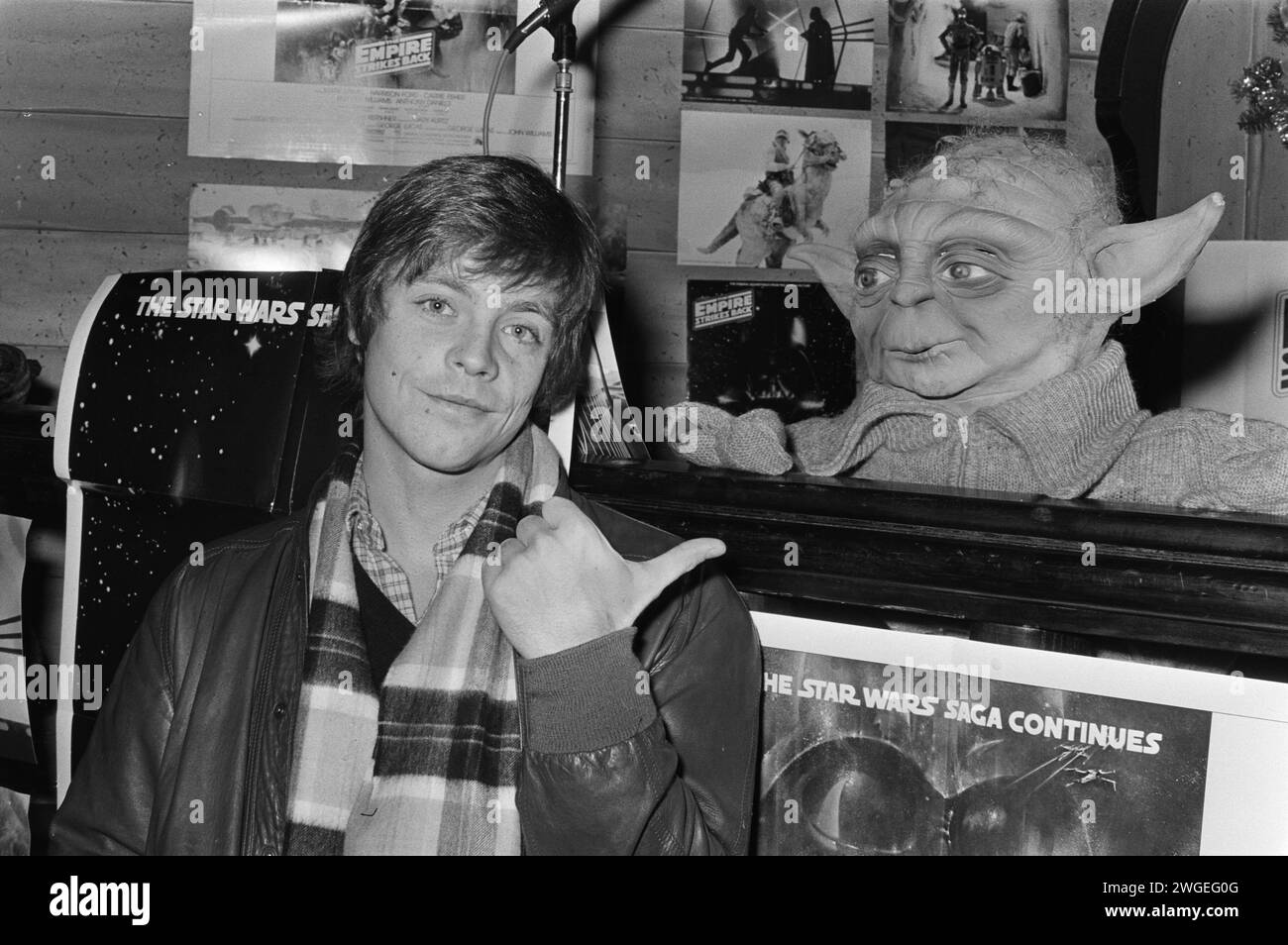 December 18, 1980. Amsterdam, Netherlands. American actor Mark Hamill who plays the role of Luke Skywalker in the movie 'The Empire strikes back' gave press conference, Mark Hamill.  Seen here talking to Yoda Stock Photo