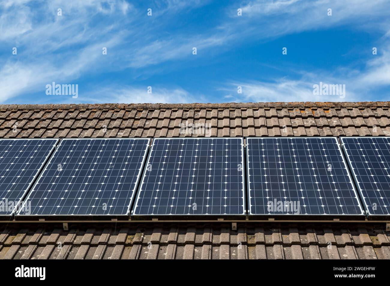 Solar panels on a domestic roof hi-res stock photography and images - Alamy