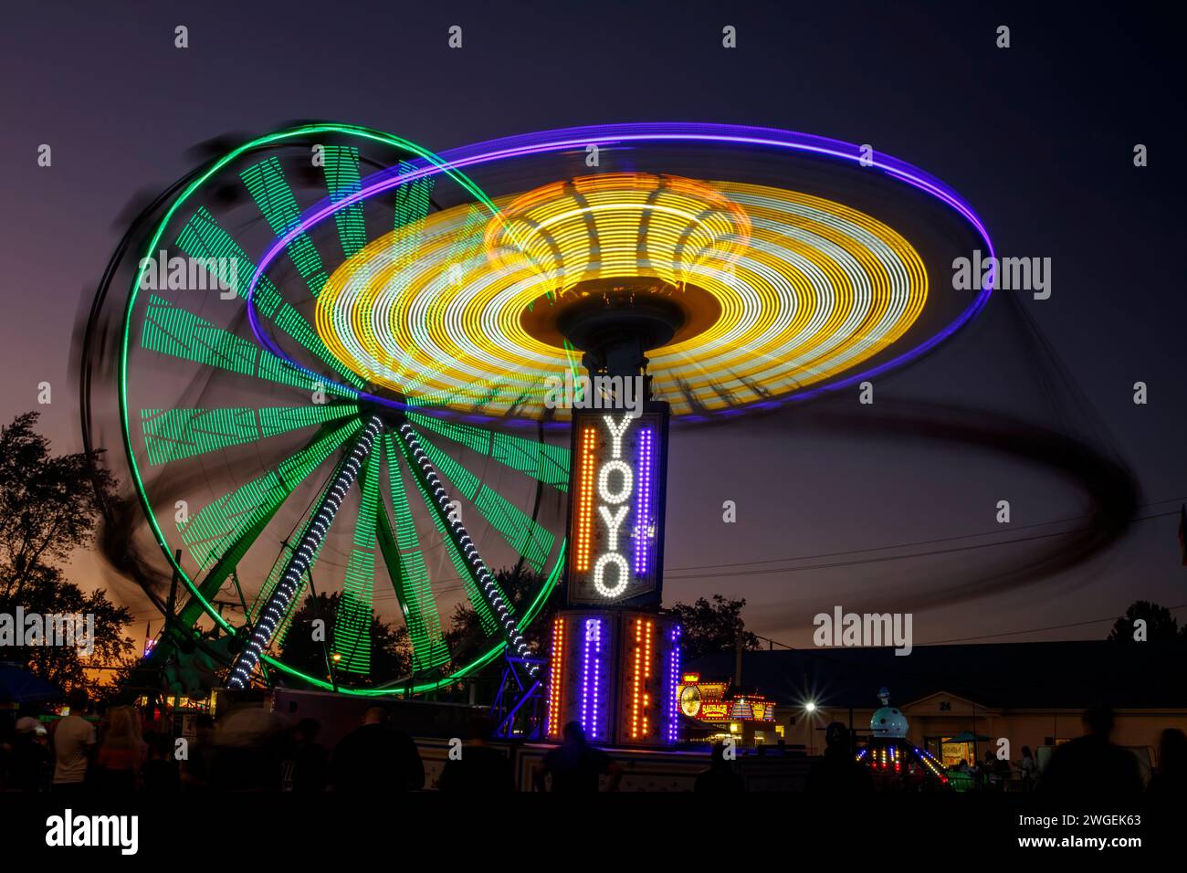 Carnival Rides with long exposure motion blur. One ride is named YoYo. Canfield Fair, Mahoning County Fair, Canfield, Youngstown, Ohio, USA. Stock Photo