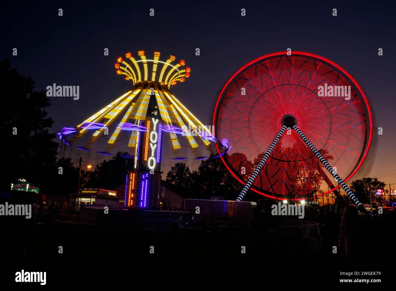 Carnival Rides with long exposure motion blur. One ride is named YoYo. Canfield Fair, Mahoning County Fair, Canfield, Youngstown, Ohio, USA. Stock Photo