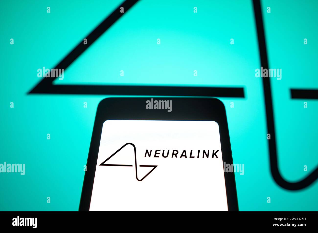 In this photo illustration, the Neuralink logo is displayed on a