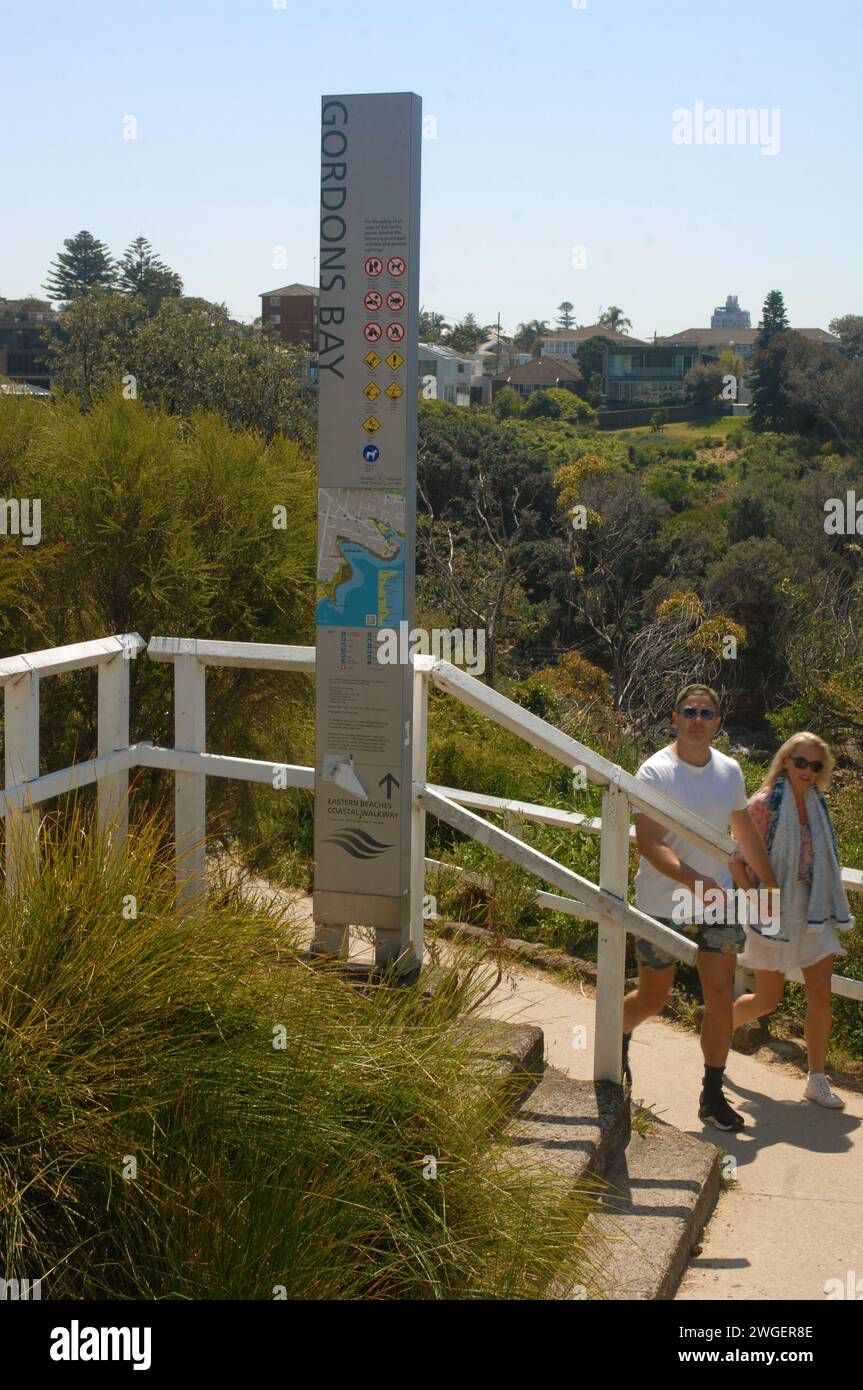 couple-walking-from-bondi-to-coogee-beach-sydney-nsw-australia-stock