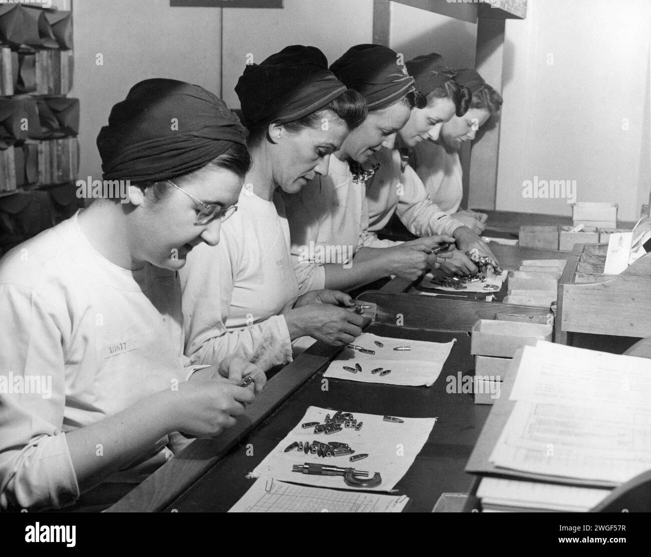 Women quality checking ammunition at General Engineering Company (Canada) munition factory during the Second World War circa 1943, in Scarborough, Ontario Stock Photo