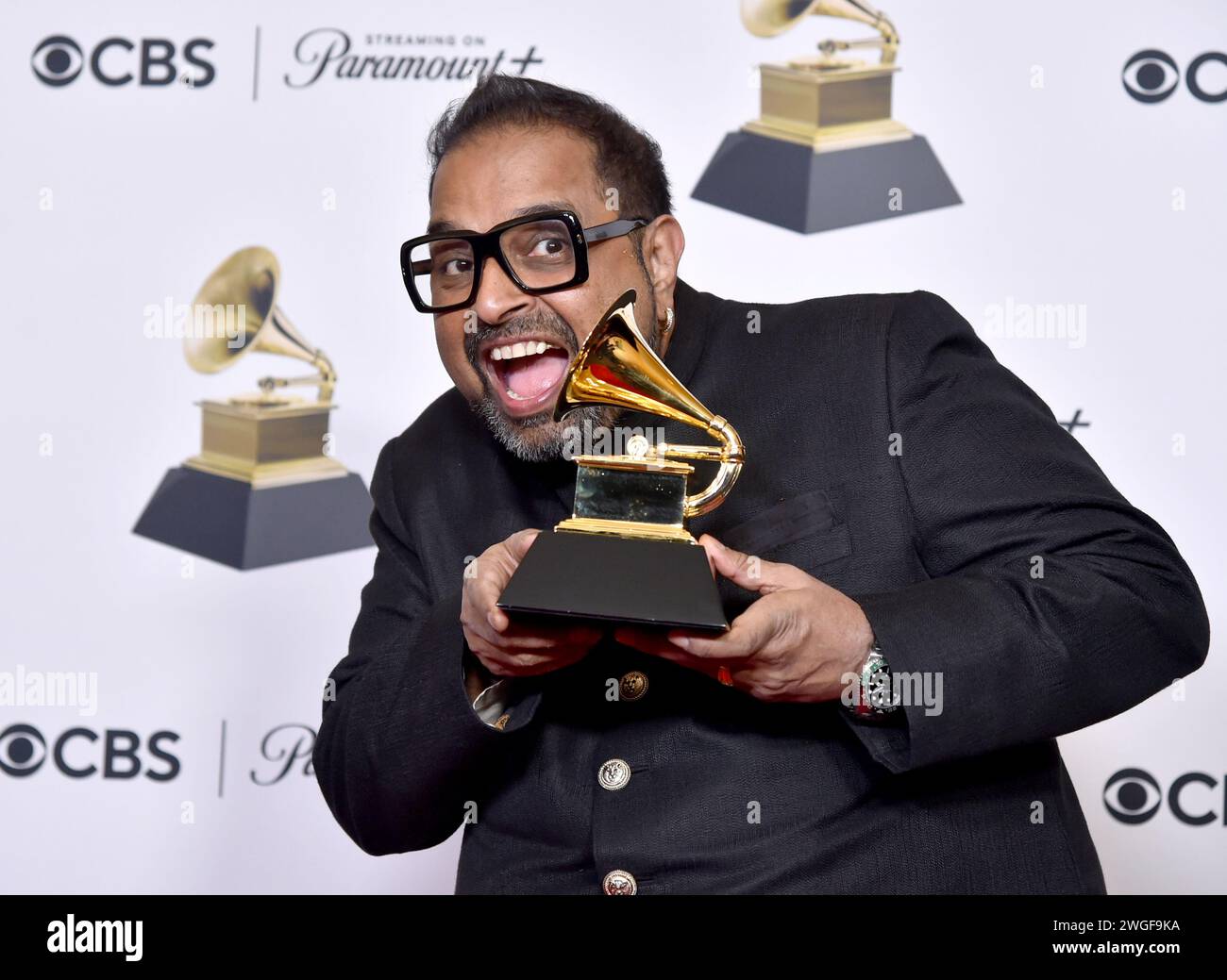 Shankar Mahadevan of Shakti poses in the press room with the award for