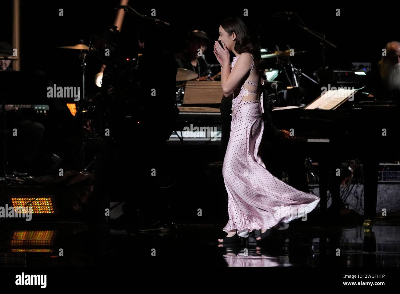 Laufey appears on stage to accept the award for best traditional pop