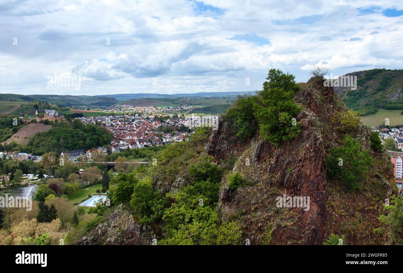 Bad Munster, Germany - May 12, 2021: Rock on Rotenfels overlooking Rheingrafenstein castle on a hill above Bad Munster on a spring day in Germany. Stock Photo