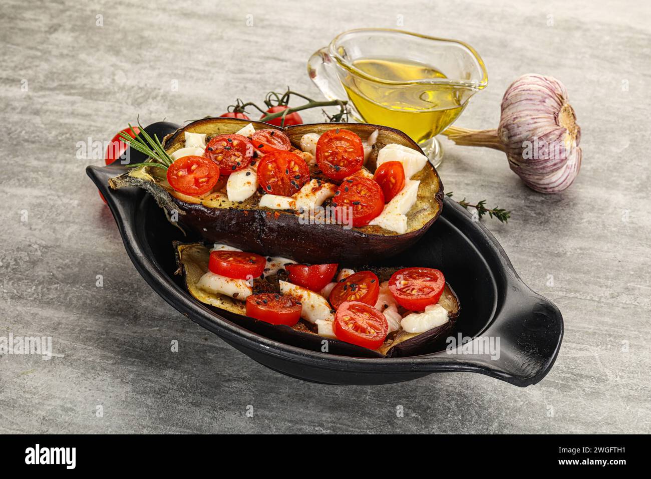 Baked eggplant with mozzarella cheese and tomato Stock Photo - Alamy